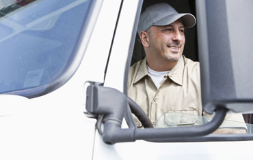 smiling man driving truck